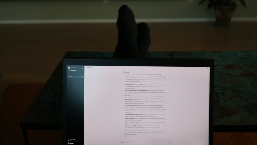 a person's feet resting on a computer screen