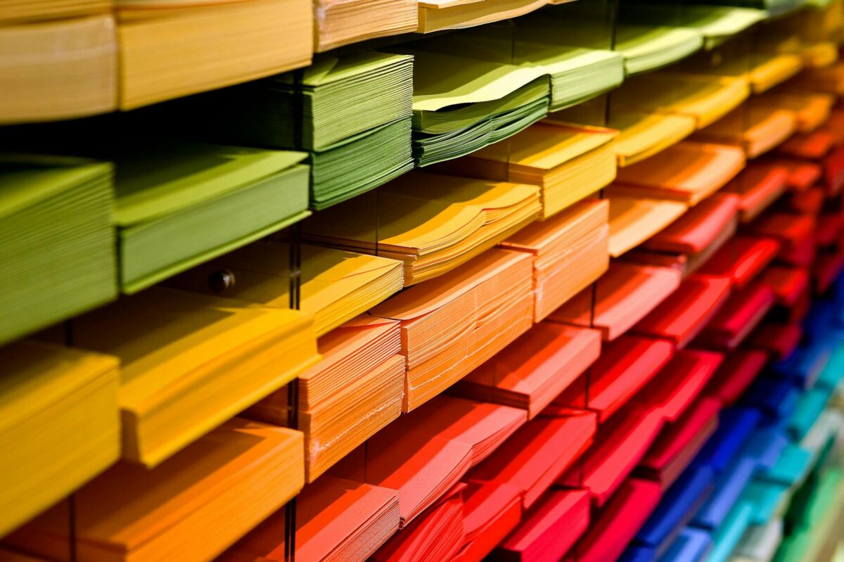 Multi colored folders piled up